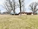 Large yard showing the side and back of the home at 812 Madison St, Frankton, IN 46044