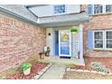Inviting front porch features a welcoming 'HOME' doormat and seasonal decorations at 8503 Hoff Ct, Indianapolis, IN 46256
