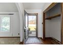 Bright entryway with hardwood floors, a coat closet, and a view to the front yard at 8831 Lincolncreek Cir, Indianapolis, IN 46234