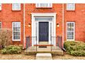 Close-up of the front door showcasing the architectural details, hardware, and welcoming entryway at 10046 Gate Dr, Indianapolis, IN 46239
