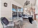 Cozy front porch features comfortable seating, a stylish swing, and an inviting atmosphere at 10706 Morristown Ct, Carmel, IN 46032