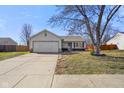 Lovely single-story home with a driveway and established landscaping in the front yard at 119 Karrington Blvd, Mooresville, IN 46158