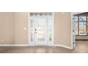 Bright foyer featuring a decorative glass front door and sidelights, leading into the home at 12067 Edgefield Dr, Fishers, IN 46037