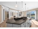 Gourmet kitchen with granite countertops, modern stainless steel appliances, and a center island at 12067 Edgefield Dr, Fishers, IN 46037