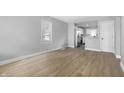 A bright and airy living room with stylish floors and a seamless open-concept design at 1323 S Ewing St, Indianapolis, IN 46203
