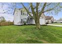Charming two-story home with blue shutters and well-manicured lawn at 14055 Mimosa Ct, Fishers, IN 46038