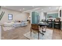 An open living space features recessed lighting, hardwood floors, and lots of natural light at 1434 S Talbott St, Indianapolis, IN 46225