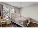 Bright bedroom with a large window, wood floors, and decorative headboard at 15214 Ten Point Dr, Noblesville, IN 46060