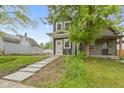 Charming two-story home with a well-manicured lawn and inviting walkway leading to the front door at 1538 Ringgold Ave, Indianapolis, IN 46203