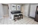 Cozy kitchen eating area with white cabinets, stylish decor, and modern gray walls at 1939 Crystal Bay E Dr, Plainfield, IN 46168