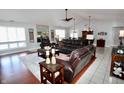 Spacious living room features hardwood floors, recessed lighting, and lots of natural light at 1939 Crystal Bay E Dr, Plainfield, IN 46168