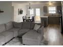 Open-concept living room and dining area with modern decor and wood floors at 2141 Galaxy Dr, Franklin, IN 46131