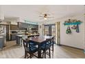 Eat-in kitchen with tile backsplash, granite countertops, and stainless steel appliances at 2165 Plantation Ln, Martinsville, IN 46151