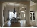 Elegant dining room with chandelier, neutral walls, and abundant natural light at 286 S Woodridge Dr, Pittsboro, IN 46167