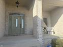 Inviting front porch featuring brick columns and a decorative front door at 286 S Woodridge Dr, Pittsboro, IN 46167