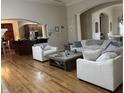 Spacious living room with wood floors, ample seating and an open concept design at 286 S Woodridge Dr, Pittsboro, IN 46167