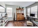 Home office with wood floors, large windows, and a stylish desk setup for a productive workspace at 3229 Autumn Ash Dr, Zionsville, IN 46077