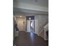 Inviting foyer with dark floors, neutral walls, and a view into a bedroom through an open doorway at 6610 Trey Ct, Camby, IN 46113