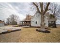 A beautiful country-style home with a large tree in the front yard and gravel driveway at 695 N 650 W, Lebanon, IN 46052