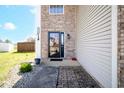 Inviting front entrance with brick accents, leading to a well-maintained home at 7136 Allegan Dr, Indianapolis, IN 46217