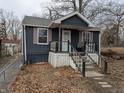 Charming home with a cozy front porch and mature trees in a quiet neighborhood at 730 Waldemere Ave, Indianapolis, IN 46241