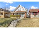 Charming two-story home with a well-maintained front yard and inviting walkway to the front door at 766 N Bancroft St, Indianapolis, IN 46201