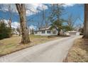 Charming single Gathering home featuring an expansive driveway and beautiful yard at 8190 Jordan Ln, Indianapolis, IN 46240