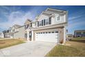 Charming two-story home with a well-maintained lawn and a two-car garage at 10202 Meadow Path Ln, Indianapolis, IN 46239