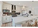 Well-lit kitchen featuring stainless steel appliances, quartz countertops, modern cabinetry, and open layout at 1208 N Alabama St, Indianapolis, IN 46202