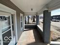 Covered front porch with gray-painted brick columns at 1342 W 18Th St, Indianapolis, IN 46202