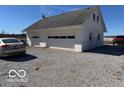 A large, detached, white garage offering plenty of space for vehicles and storage at 13863 N Stiles Rd, Mooresville, IN 46158