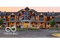 Well-lit beautiful building featuring an american flag, many windows, and well manicured yard at 1558 Old Hickory Ln, Westfield, IN 46074