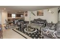 This elegant living room features unique furniture, artwork and lighting at 3219 E Maygrove Dr, Danville, IN 46122