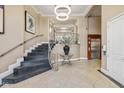 Elegant foyer with staircase, elevator, and ornate decorative touches creates a welcoming atmosphere at 355 E Ohio E St # 206, Indianapolis, IN 46204
