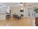 Bright living room with hardwood floors, fireplace, and balcony access offers comfortable living space at 355 E Ohio E St # 206, Indianapolis, IN 46204