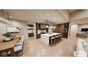 Spacious kitchen with waterfall island, pendant lighting, integrated refrigerator, and stainless steel appliances at 4094 Chapel Hill Ct, Bargersville, IN 46106