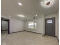 Inviting living room with a large window and neutral color palette, offering a bright and airy atmosphere at 6780 N Michigan Rd, Fairland, IN 46126