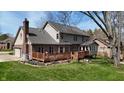 The back exterior features a large deck perfect for entertaining and enjoying the backyard at 895 Baywood Ct, Columbus, IN 47201