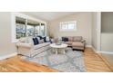 Cozy living room showcasing plush sofas, a stylish rug, and a sunlit atmosphere at 900 W Oak St, Zionsville, IN 46077