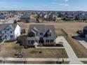 Expansive aerial view of a two-story home within a residential neighborhood and spacious backyard at 10055 Win Star Way, Fishers, IN 46040