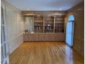 Home office with custom built-in shelving, cabinets, and a sink at 10136 Summerlakes Dr, Carmel, IN 46032