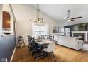 Open-concept dining area features a large dining table and views of the living room at 10441 Alexia Dr, Indianapolis, IN 46236