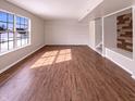 Spacious living room with hardwood flooring, ample natural light, and neutral color palette at 1155 Dark Star Ct, Whiteland, IN 46184