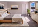 Cozy bedroom with a large window, soft carpet, and a comfortable bed at 1155 Dark Star Ct, Whiteland, IN 46184