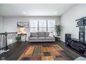Bright living room with large windows, a comfortable sofa, and stylish decor at 12723 Apsley Ln, Carmel, IN 46032