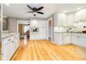 Spacious kitchen with white cabinets, hardwood floors, and an open layout at 13661 Smokey Ridge Pl, Carmel, IN 46033