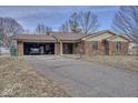 Inviting brick home with an attached garage, offering comfort and convenience in a serene residential area at 1612 Westbay Ct, Indianapolis, IN 46260