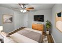 Stylized bedroom with modern décor, wood flooring, and a large window with natural light at 1825 E 49Th St, Anderson, IN 46013