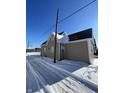 Exterior view of home showing snowy yard and side of house at 2133 Webb St, Indianapolis, IN 46225