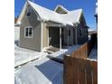 Cozy home with covered porch and snow-covered yard at 2133 Webb St, Indianapolis, IN 46225